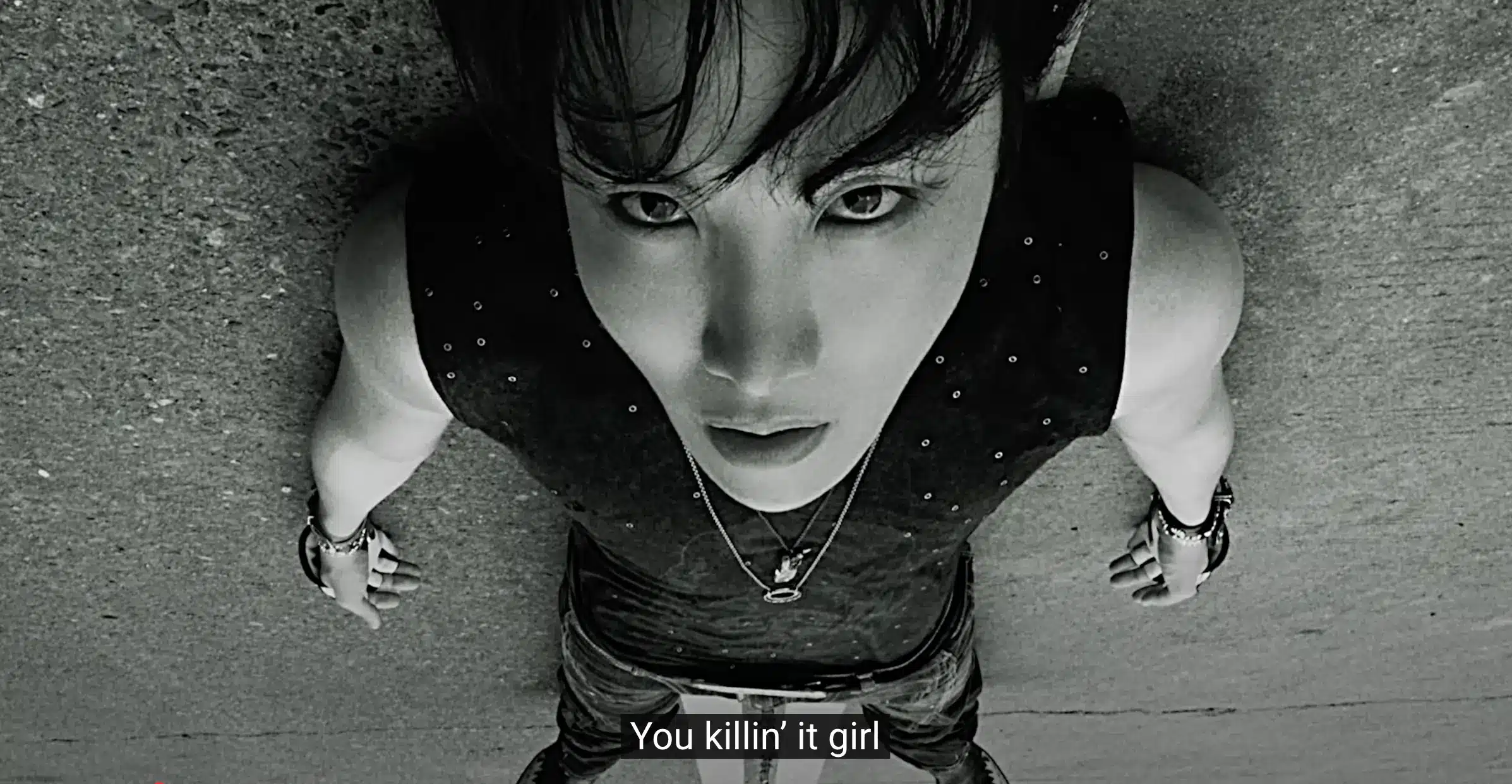 j‑hope performing in ‘Killin it girl’ official music video with dynamic choreography and vibrant stage lighting featuring GloRilla cameo