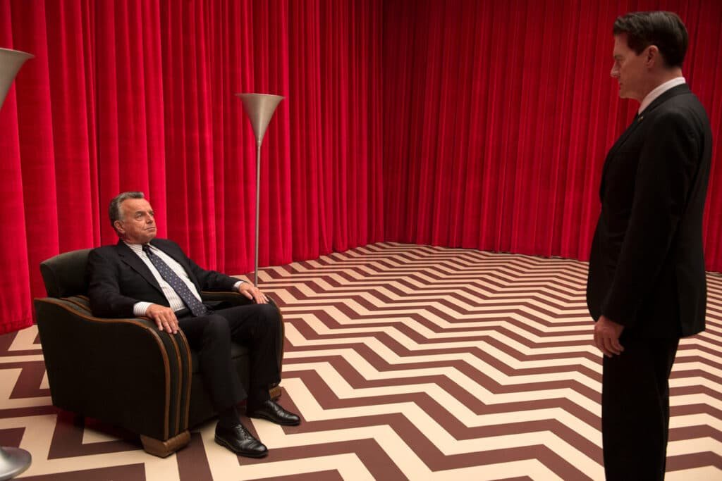 David Lynch’s director’s chair with red curtain backdrop